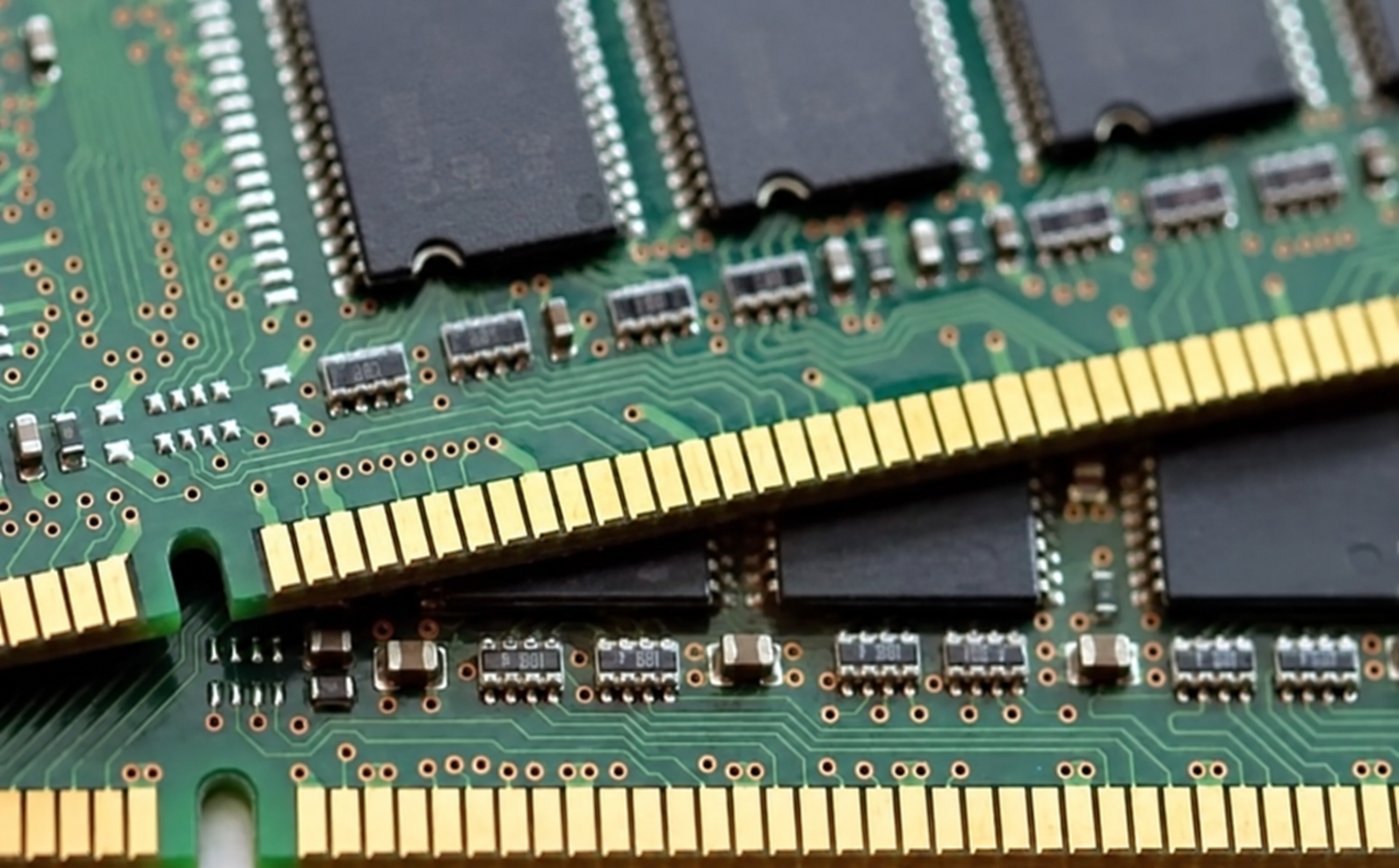 Photographic reference showing circuit boards with keyed gold edge contacts